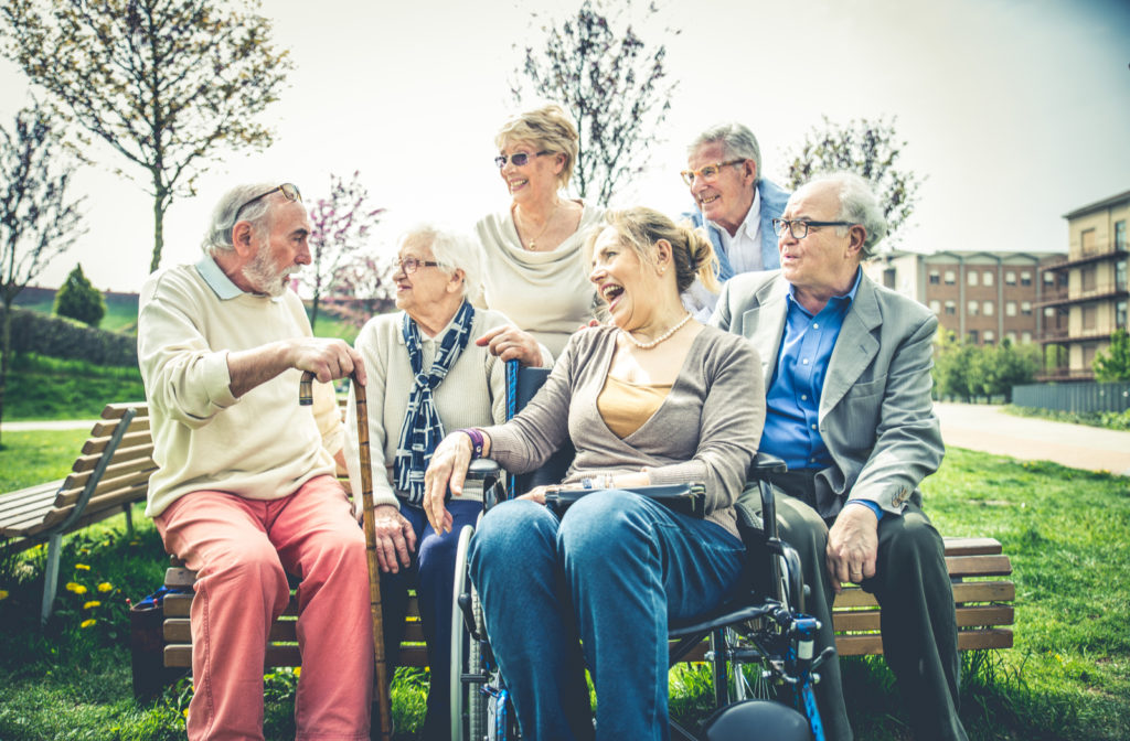 Seniors socializing with one another in senior garden